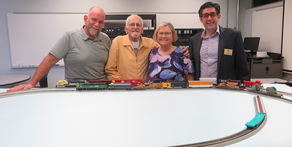 Donors pose with railroad test bed
