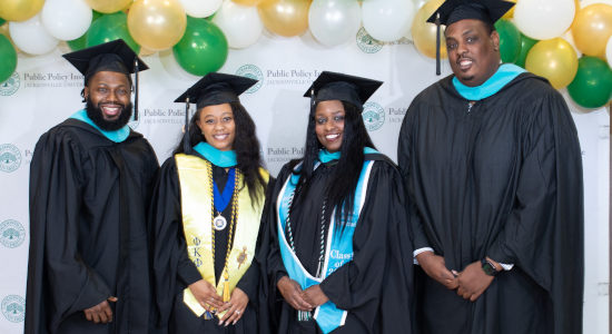 a group of graduating students wearing graduation regalia
