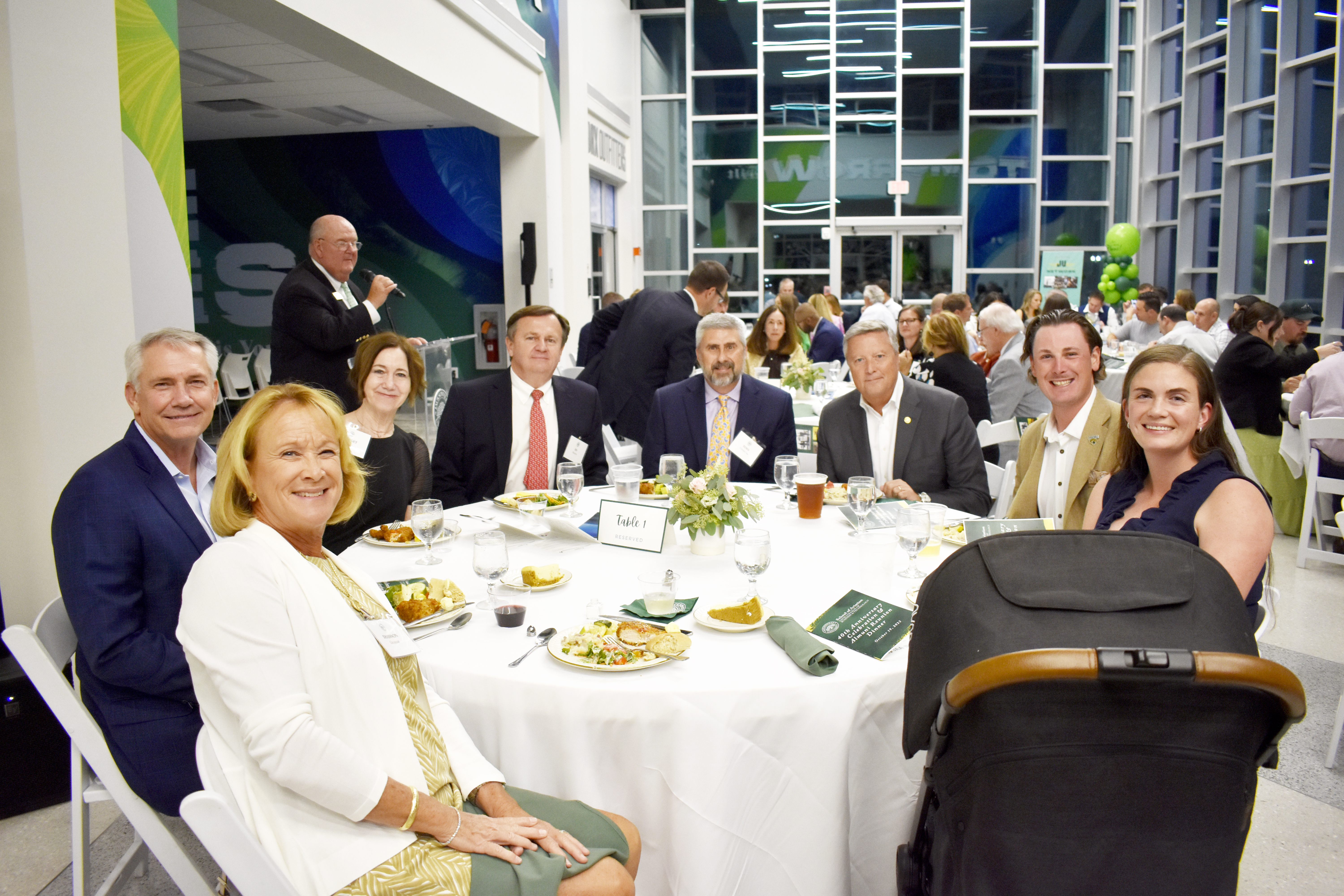 Ryan Smith seated at table with Tim Cost