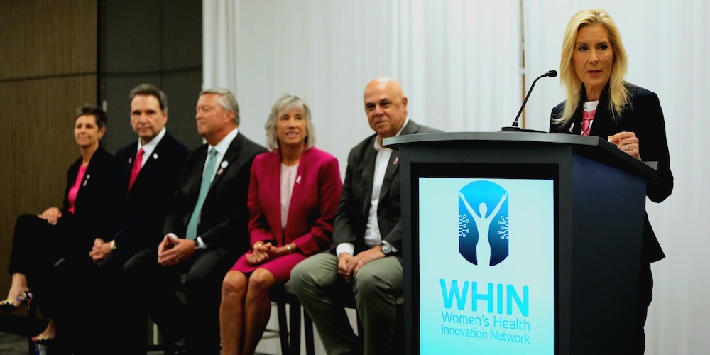 Mayor Donna Deegan speaks at the podium at the WHIN launch