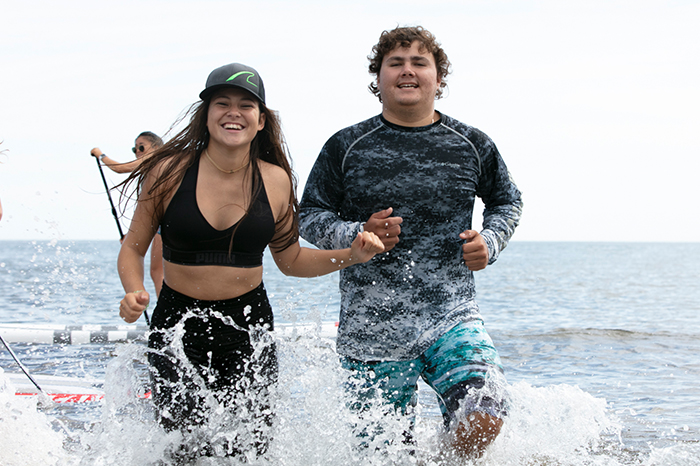 Students splashing in the water. 