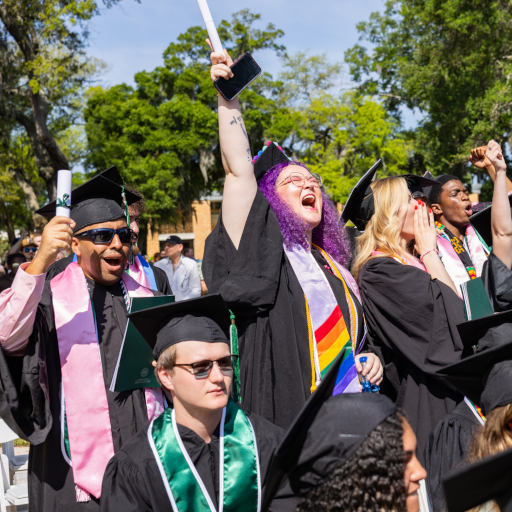 students wearing graduation regalia