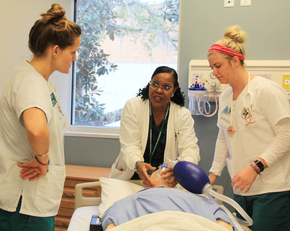 Nursing Students and Instructor on a simulation exercise applying an oxygen mask