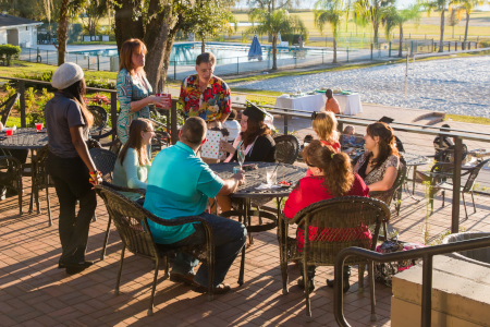 a group of people picking up swags at a swag table