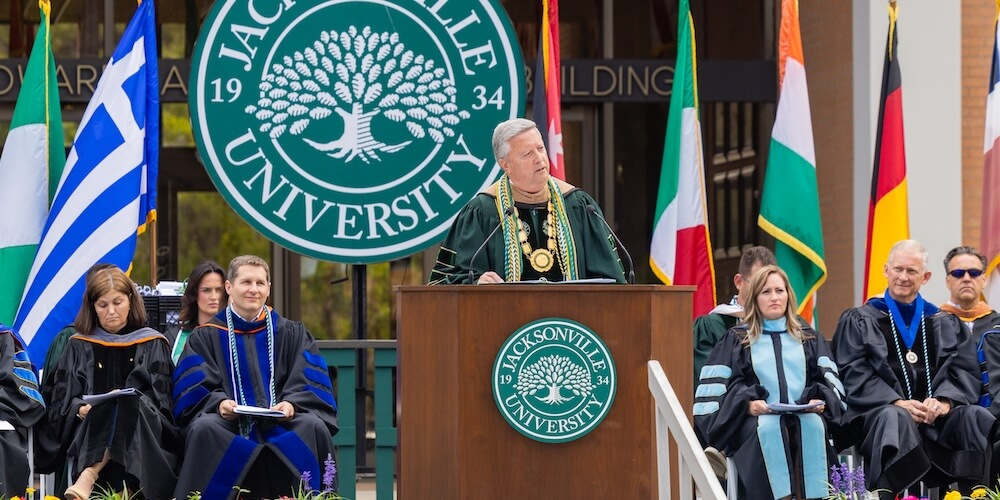 President Tim Cost on stage at Graduation