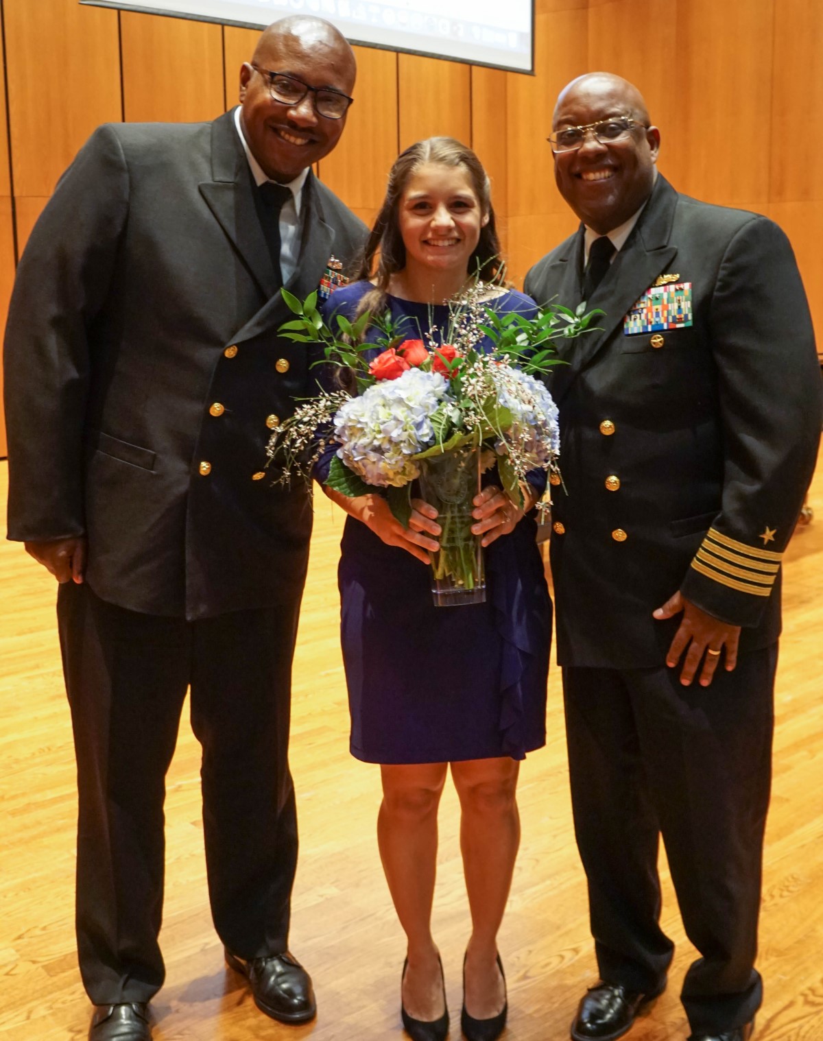 From left to right: Senior Chief Mark Buchanan, Leticia Fontes-Ferraz, Captain Glenn Leverette