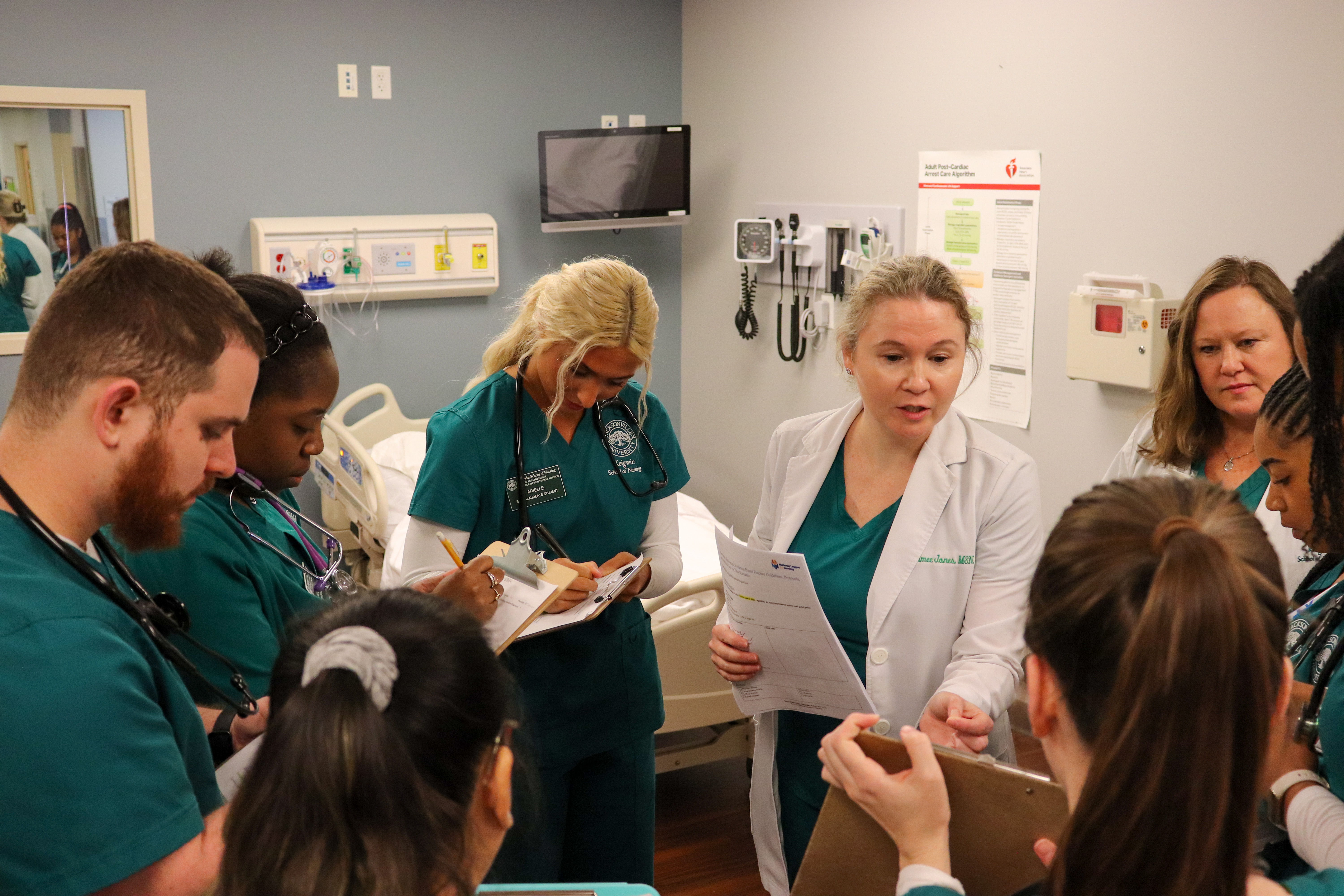 Jacksonville University professor debriefing nursing students before simulation