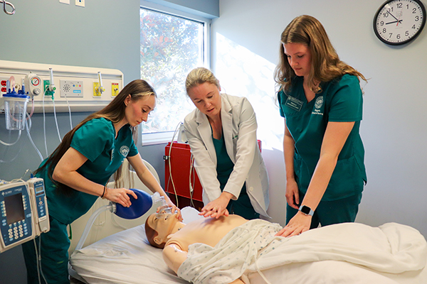 Jacksonville University professor teaching CPR to nursing students